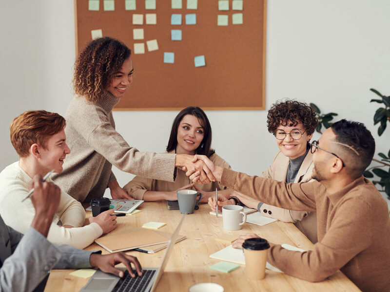 Group of people networking and smiling